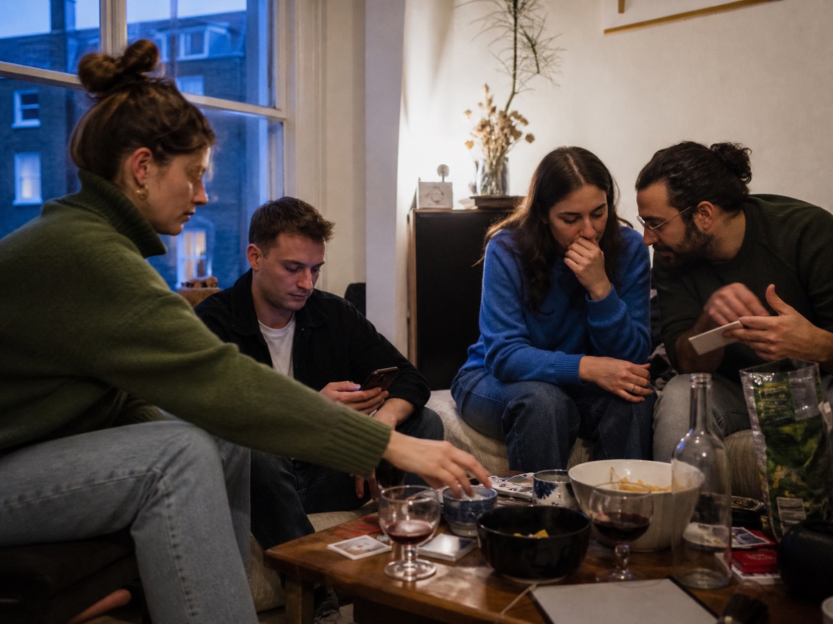 Friends playing a party game together at home